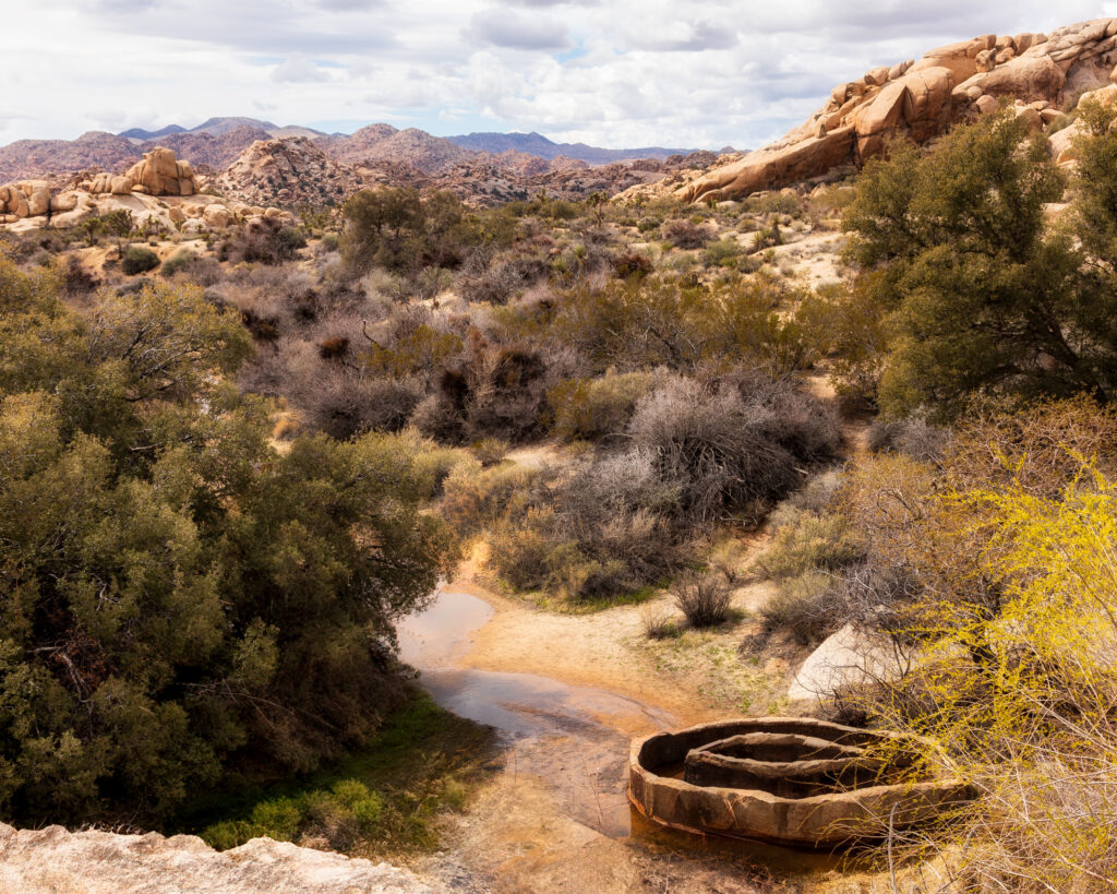 water, structure, desert landscape, cloudy sky