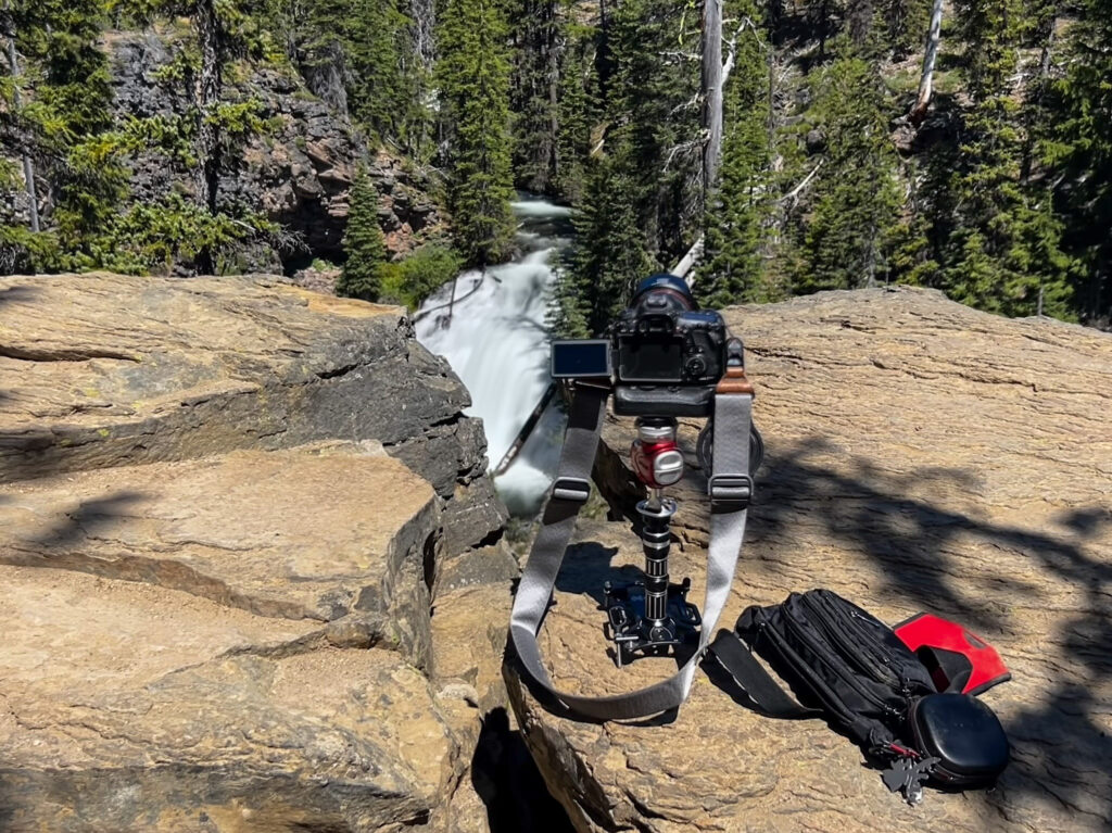 camera gear, waterfall, rock, trees