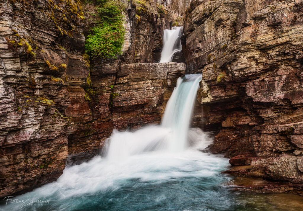 Two-tiered waterfall in a rocky landscape