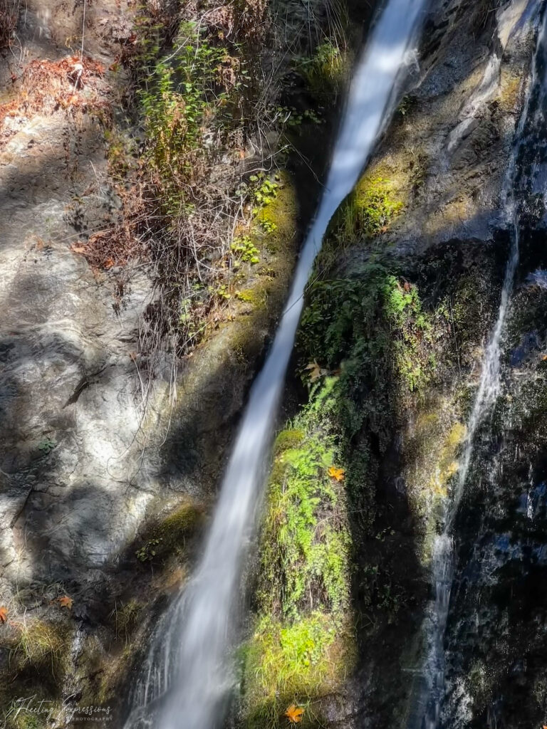 small waterfall flowing down a rock face