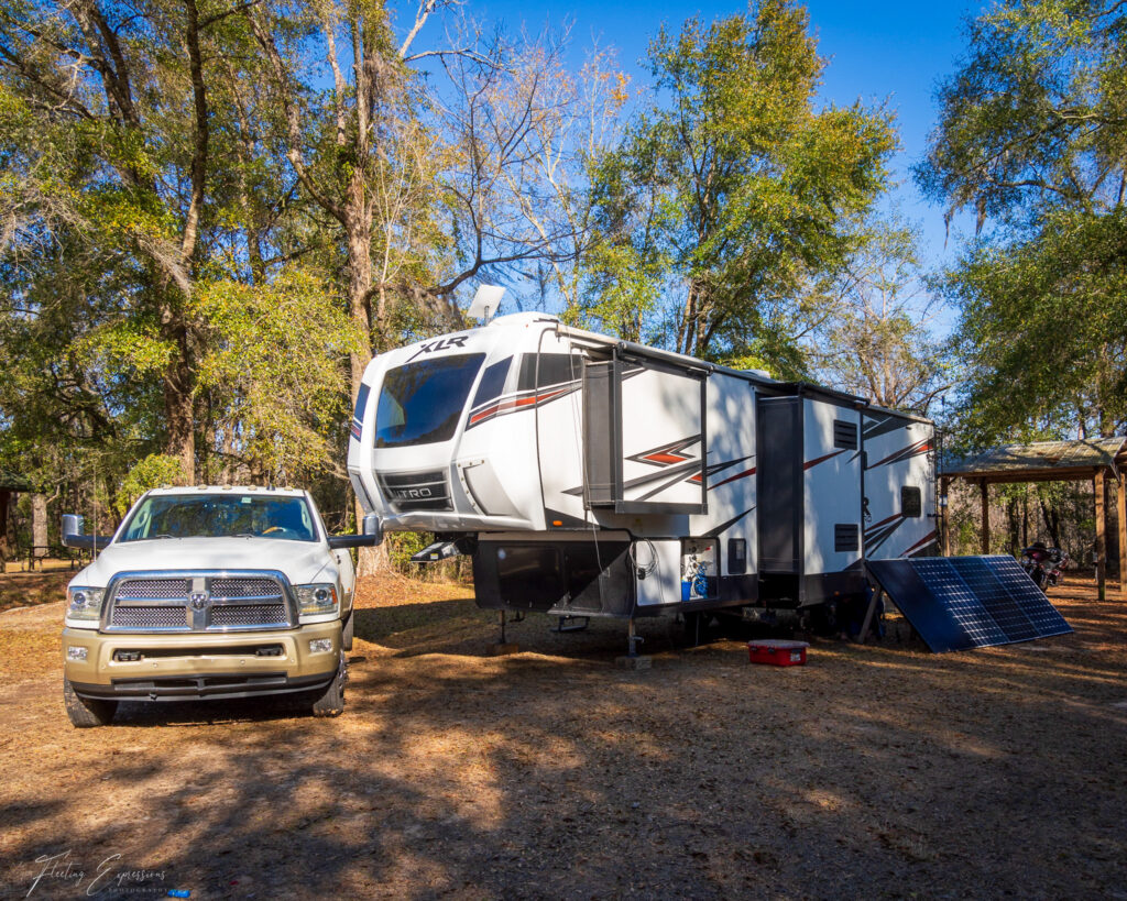 RV trailer in forested area